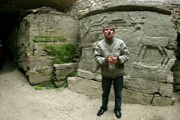 Busha. Man who believes in authenticity of wall pictures Vinnytsia Region Ukraine photos