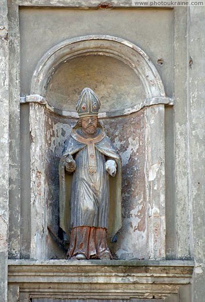 Olyka. Sculpture in niche front facade Trinity church Volyn Region Ukraine photos