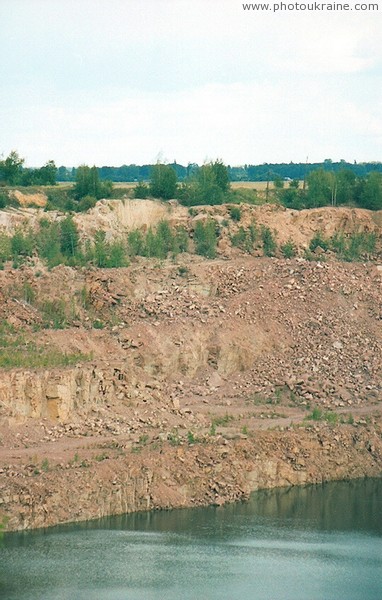 Lyznyk. Ledges of granite quarry Zhytomyr Region Ukraine photos