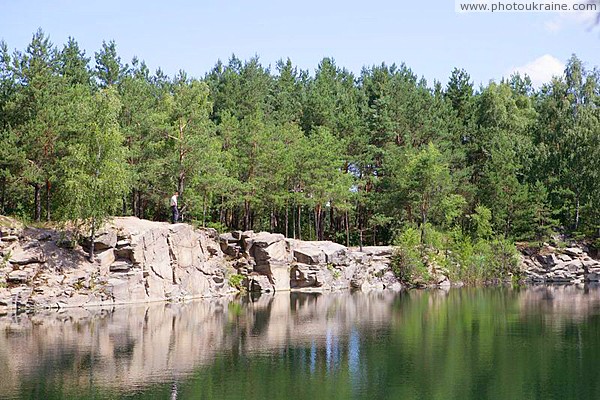 Deep lake with granite shores Zhytomyr Region Ukraine photos