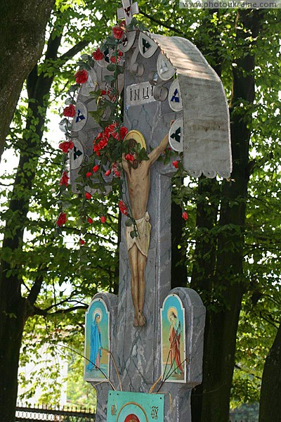 Deshkovtysia. Crucifix in front of church of Intercession Zakarpattia Region Ukraine photos