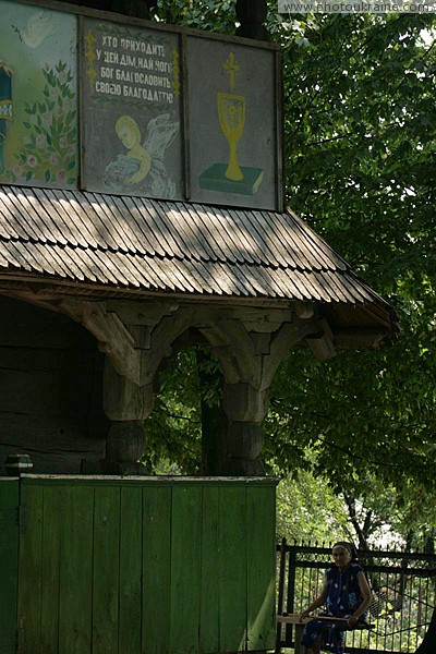 Deshkovtysia. Parishioner at entrance of temple Zakarpattia Region Ukraine photos