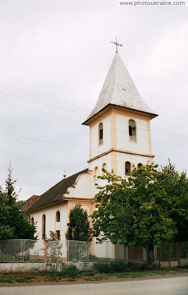 Bene. Church in village center Zakarpattia Region Ukraine photos