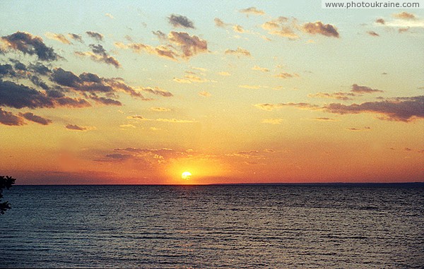 Skelky. Sun sets in man-made sea Zaporizhzhia Region Ukraine photos