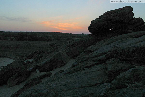 Terpinnia. Mysteriously sunset Stone Grave Zaporizhzhia Region Ukraine photos