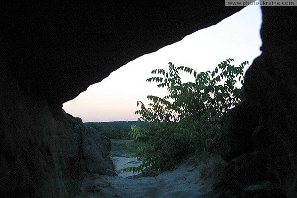 Terpinnia. Pale rays of sun on walls of grotto Zaporizhzhia Region Ukraine photos