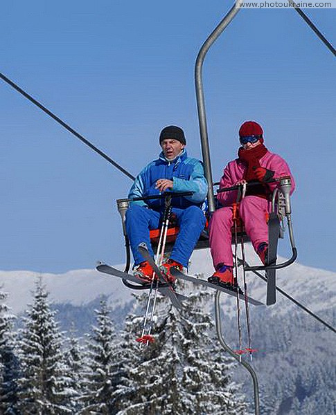 Bukovel. Skiers on a 2-chair lift Ivano-Frankivsk Region Ukraine photos
