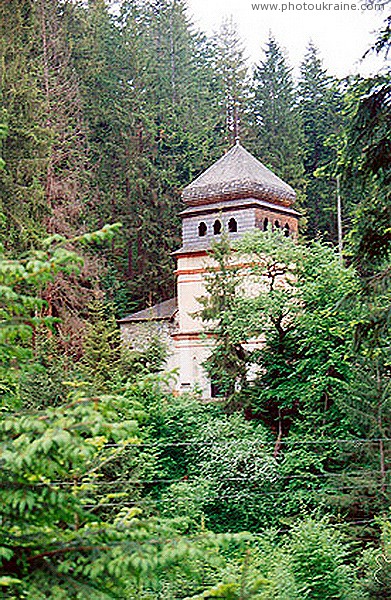 Maniavsky monastery. Gate tower bell tower in the forest Ivano-Frankivsk Region Ukraine photos