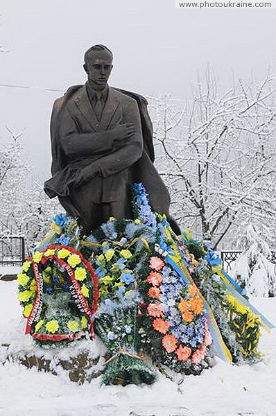 Staryi Ugryniv. Covered with wreaths monument of S. Bandera Ivano-Frankivsk Region Ukraine photos