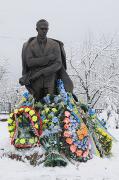 Staryi Ugryniv. Covered with wreaths monument of S. Bandera, Ivano-Frankivsk Region, Monuments 