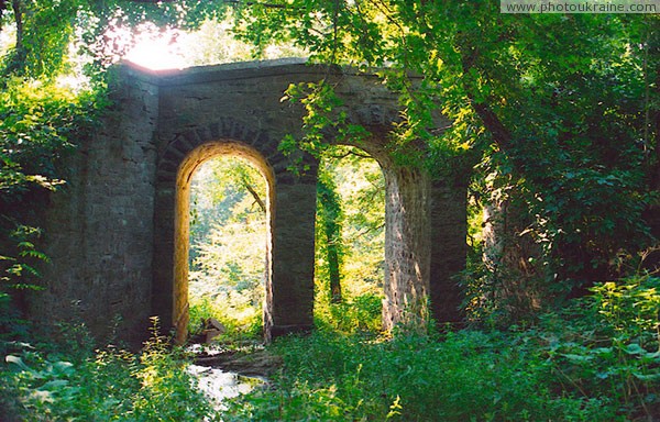 Kotyuzhany. Long stone park bridge  Vinnytsia Region Ukraine photos