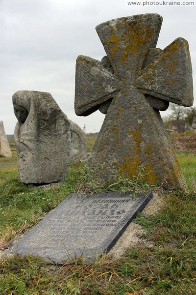 Busha. Cross and tombstone at grave of Mikhail Cossack Vinnytsia Region Ukraine photos