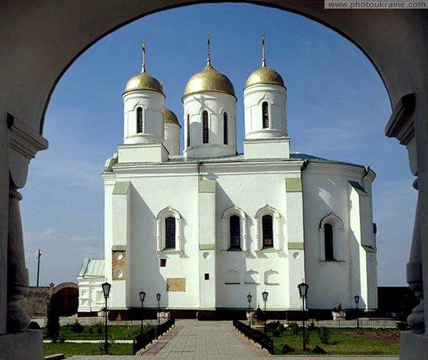 Zymne. View of Assumption cathedral from main entrance under bell tower Volyn Region Ukraine photos