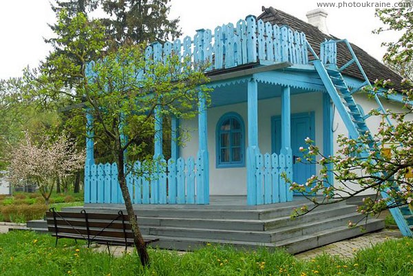 Kolodyazhne. Carved White house porch Volyn Region Ukraine photos