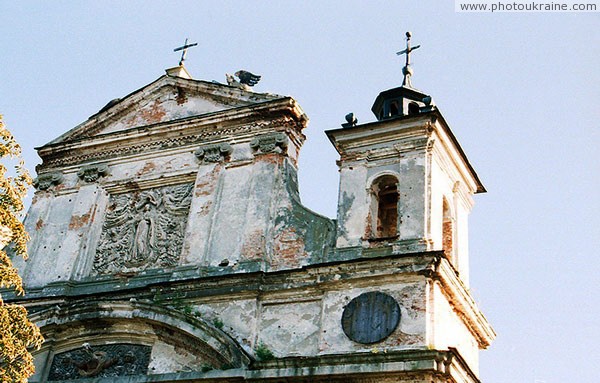 Olyka. Upper part of front facade of Trinity church Volyn Region Ukraine photos