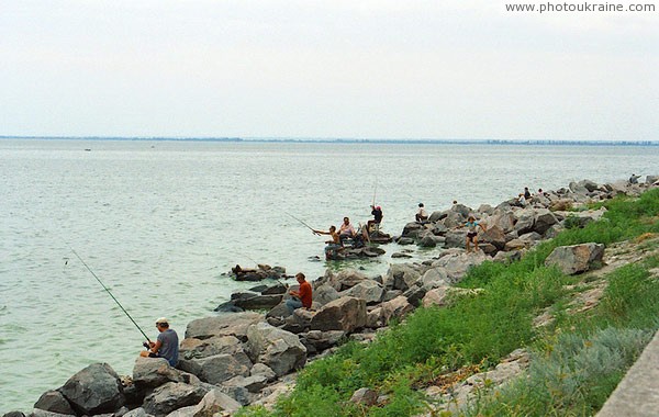 Nikopol. Urban fishermen at dam Dnipropetrovsk Region Ukraine photos