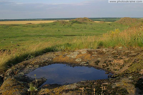 Kamiani Mohyly Reserve. Rain bowl Donetsk Region Ukraine photos