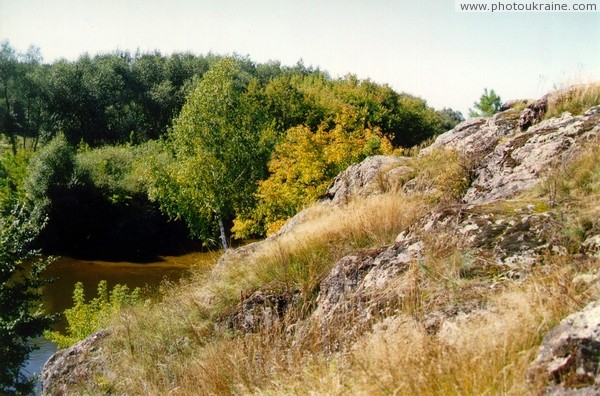 Vysokyi Kamin. 10-meter high rock above black cock Zhytomyr Region Ukraine photos