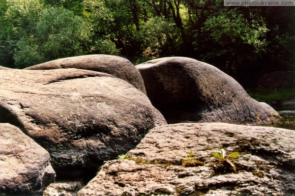 Korosten. Pink granite in mainstream of river Uzh Zhytomyr Region Ukraine photos