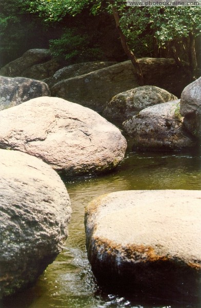 Korosten. Boulders of granite in mainstream Uzh Zhytomyr Region Ukraine photos