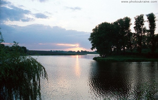 Sunset over pond Zhytomyr Region Ukraine photos