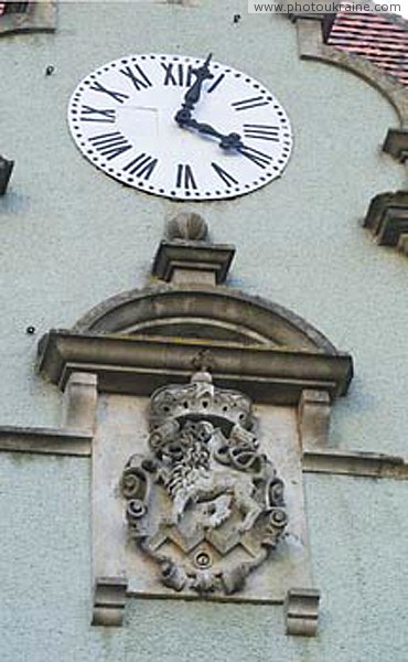 Karpaty. Clock and count's coat of arms Zakarpattia Region Ukraine photos