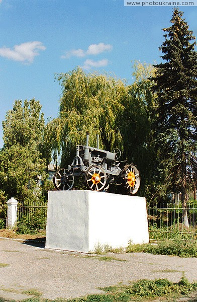 Prymorsk. Monument to tractor  toiler fields Zaporizhzhia Region Ukraine photos