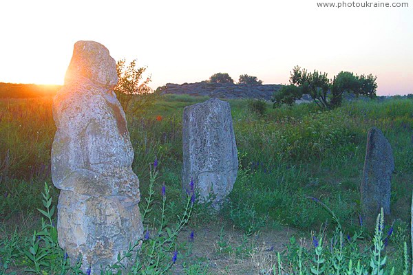 Terpinnia. Sun rises over stone graves Zaporizhzhia Region Ukraine photos