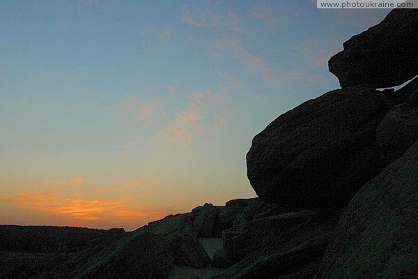 Terpinnia. Sunset over stone graves Zaporizhzhia Region Ukraine photos