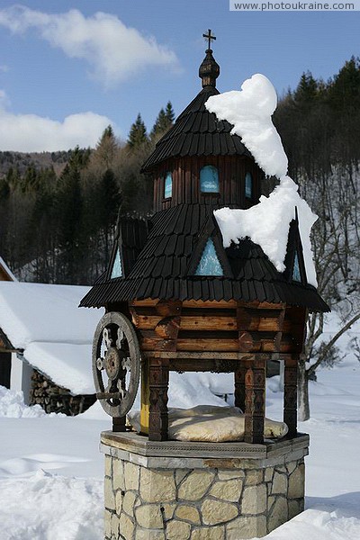Dora. Snow Covered Monastery Well Ivano-Frankivsk Region Ukraine photos