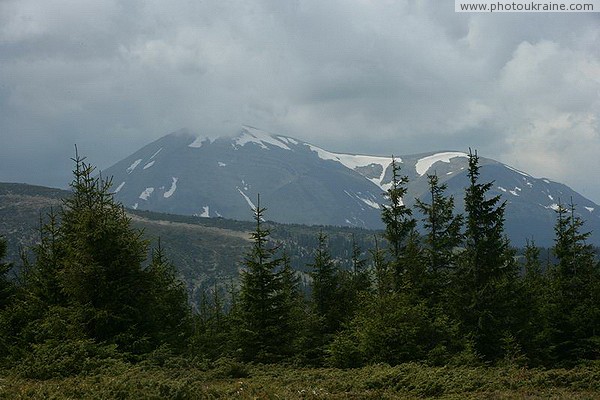 Carpathian NNP. Clinging clouds mountain peak Ivano-Frankivsk Region Ukraine photos