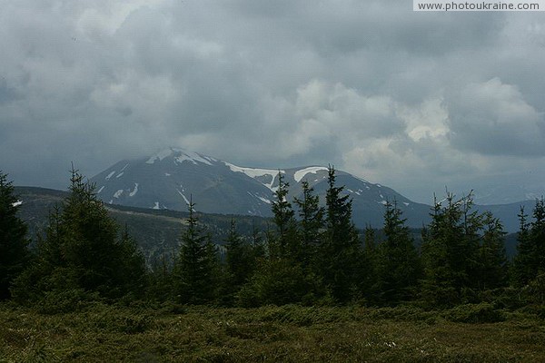 Carpathian NNP. Braking clouds mountain peak Ivano-Frankivsk Region Ukraine photos