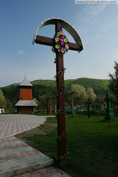 Sheshory. The bell tower of the Church of St. Paraskeva and the cross Ivano-Frankivsk Region Ukraine photos