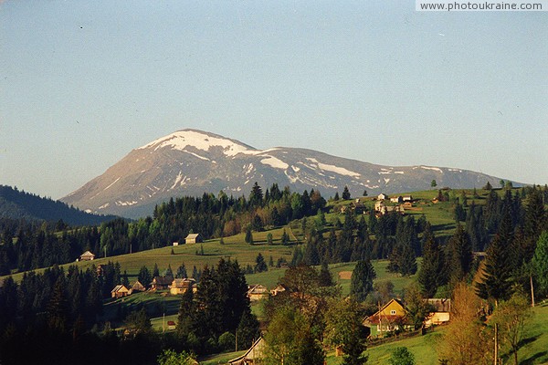 Yablunytsia. Carpathian village on the background of Mount Petros Ivano-Frankivsk Region Ukraine photos