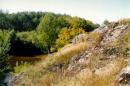 Vysokyi Kamin. 10-meter high rock above black cock, Zhytomyr Region, Geological sightseeing 