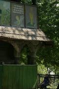 Deshkovtysia. Parishioner at entrance of temple, Zakarpattia Region, Churches 